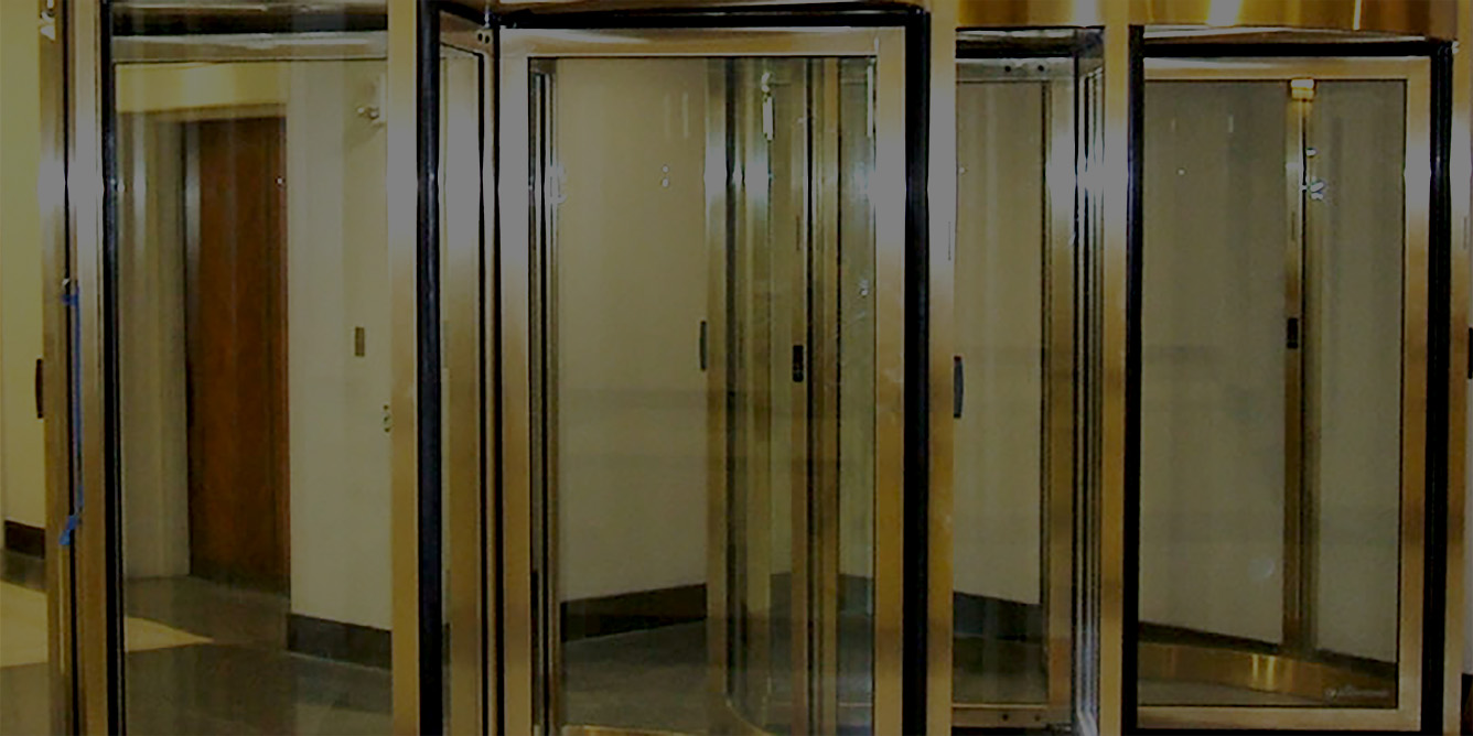 Automatic revolving door installation for commercial buildings and security entrances.